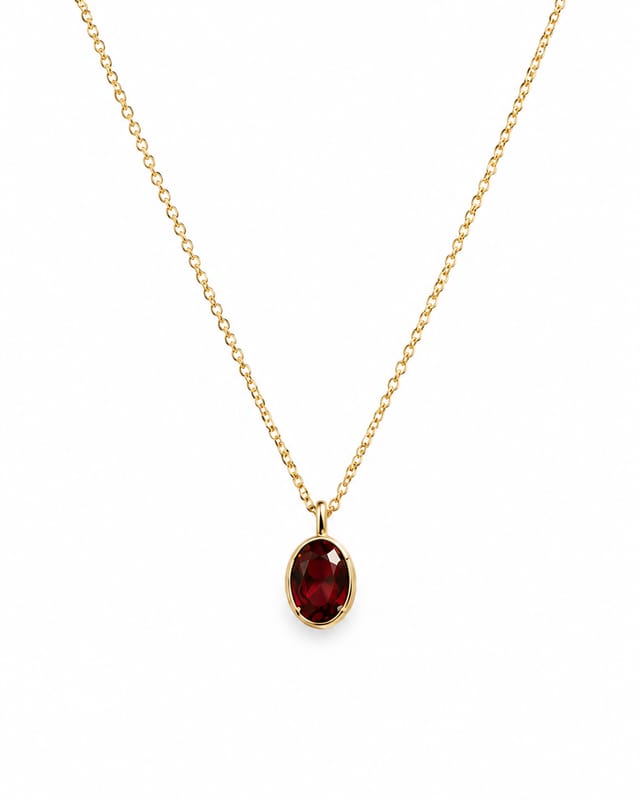The oval birthstone necklace with one deep red January garnet-coloured stone