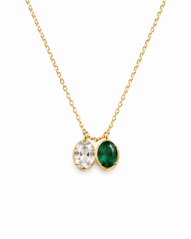 The oval birthstone necklace with two stones — clear April beside green May